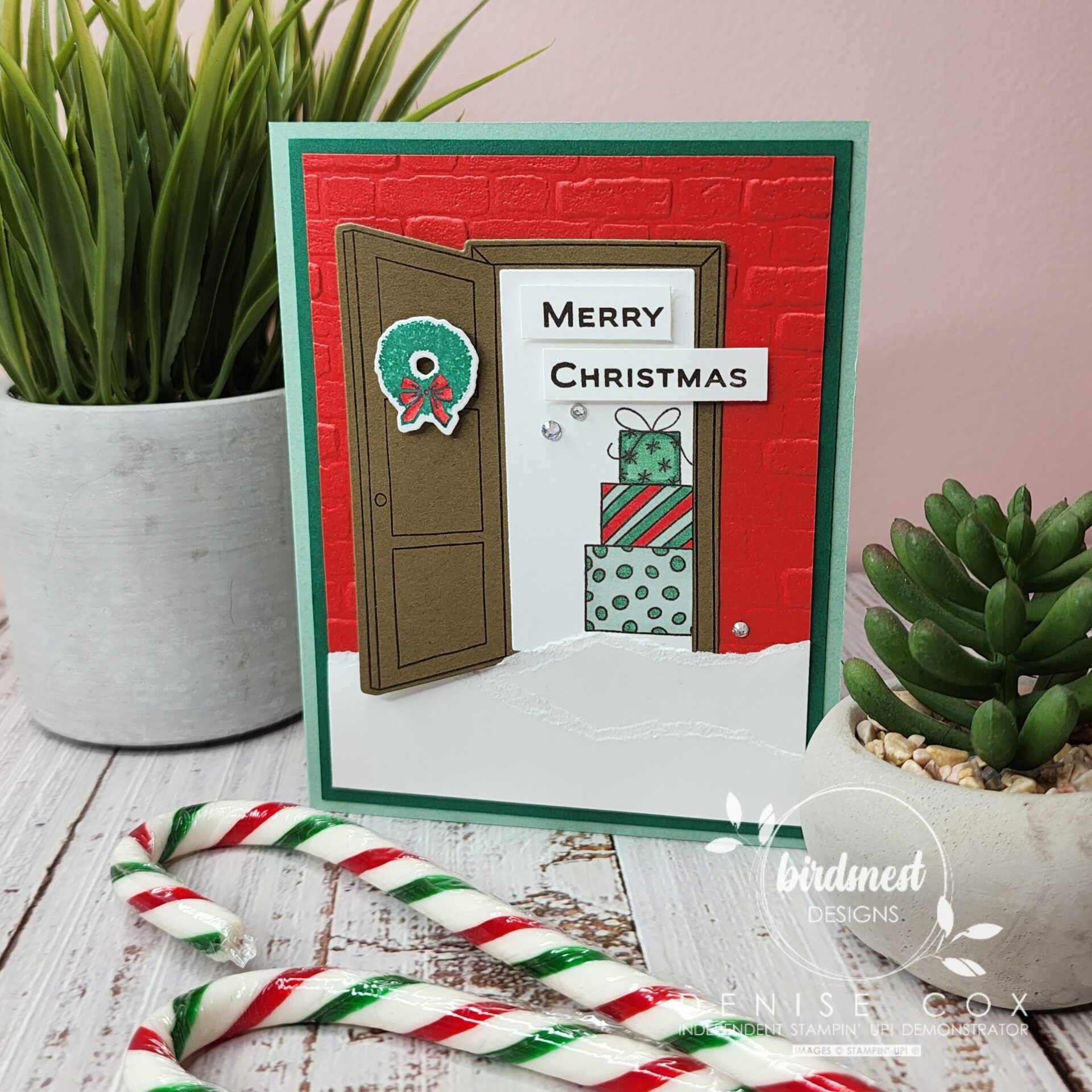 Photo of the Christmas Card with candy canes laying in front