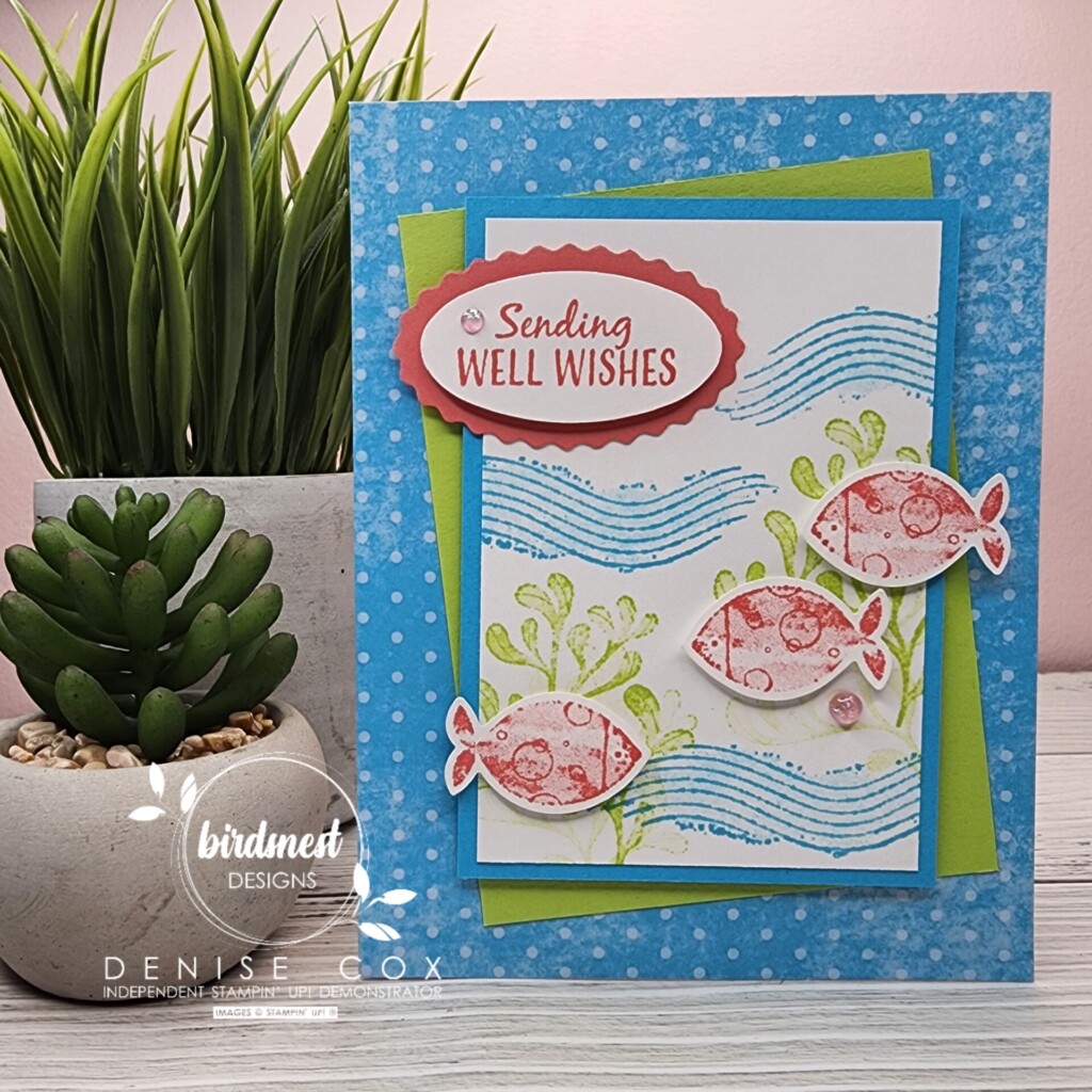 Photo of the Stampin' Up! A Fish & A Wish sending wishes card standing on a table by some plants