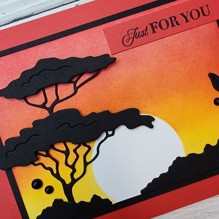 Close up of the blended sunset on the front of the Rhin Ready card