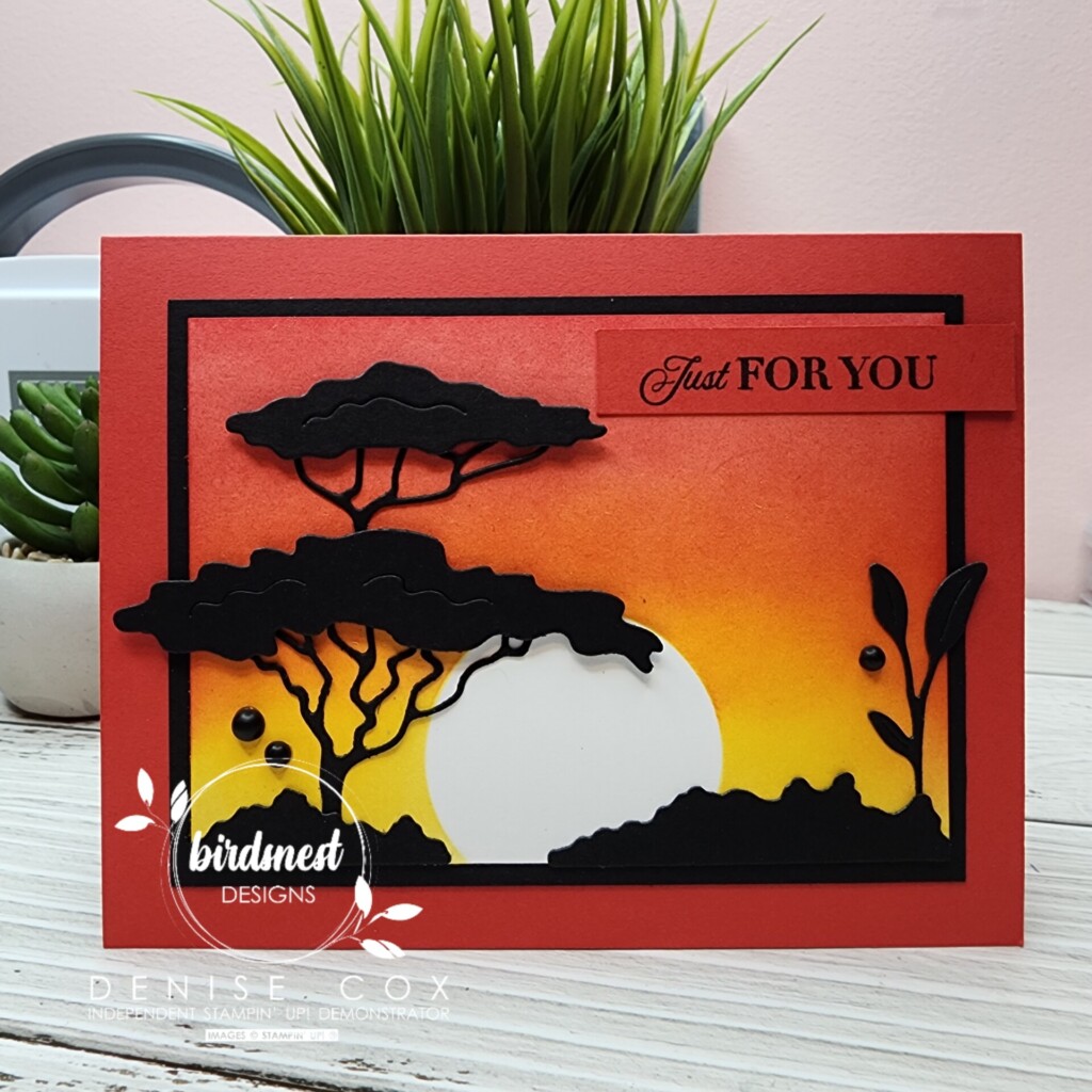 Photo of the Stampin' Up! Rhino Ready card with the sunset background displayed on a table