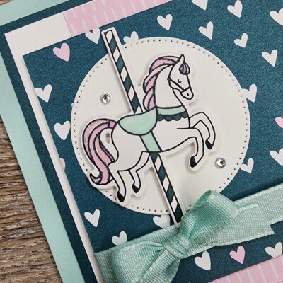 Close up photo of the Carousel Horse on the card front
