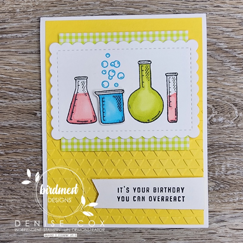 Photo of the yellow It's A Science card with 4 beakers on the front