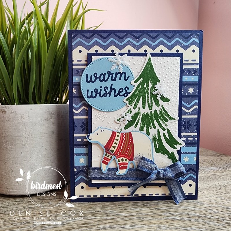 Photo of the Beary Cute Christmas card displayed on a table next to a plant