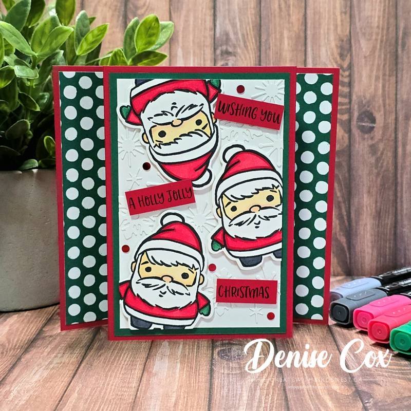 Handmade pop-up Christmas card featuring three coloured Santas from the Festive Friends bundle, layered on embossed snowflakes with polka dot side panels.