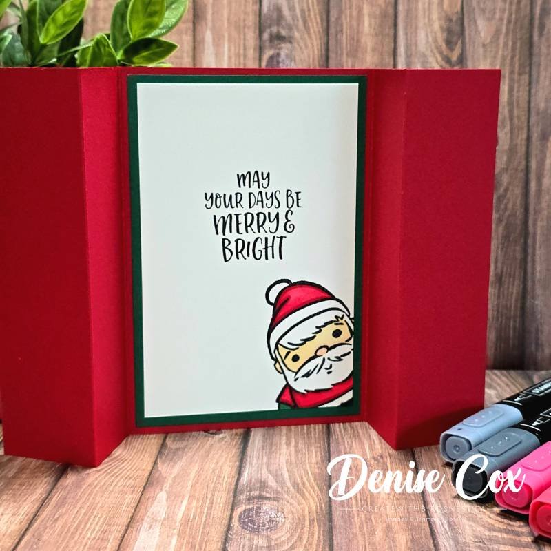 Inside of pop-up Christmas card with Merry & Bright sentiment and a Santa peeking from the corner, layered on Shaded Spruce and Real Red cardstock.