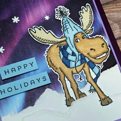 Close-up of moose stamped image coloured with Blends on Lights of Aurora DSP background.