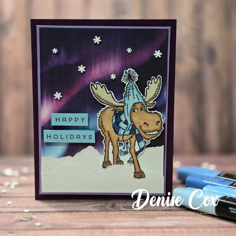 Winter moose Christmas card with northern lights background and torn white snowbanks