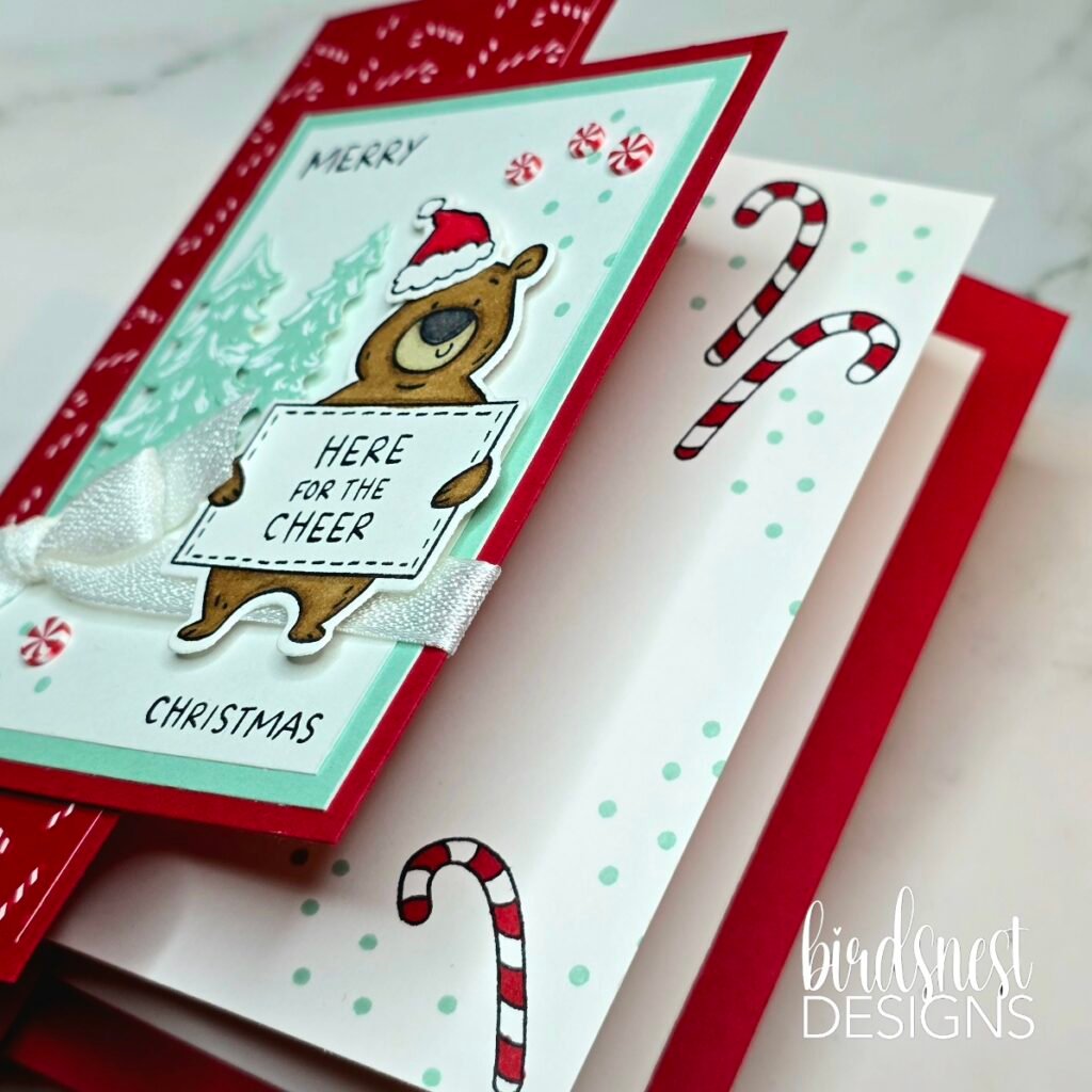 Christmas bear fun fold card opened to reveal a candy cane decorated inner panel.